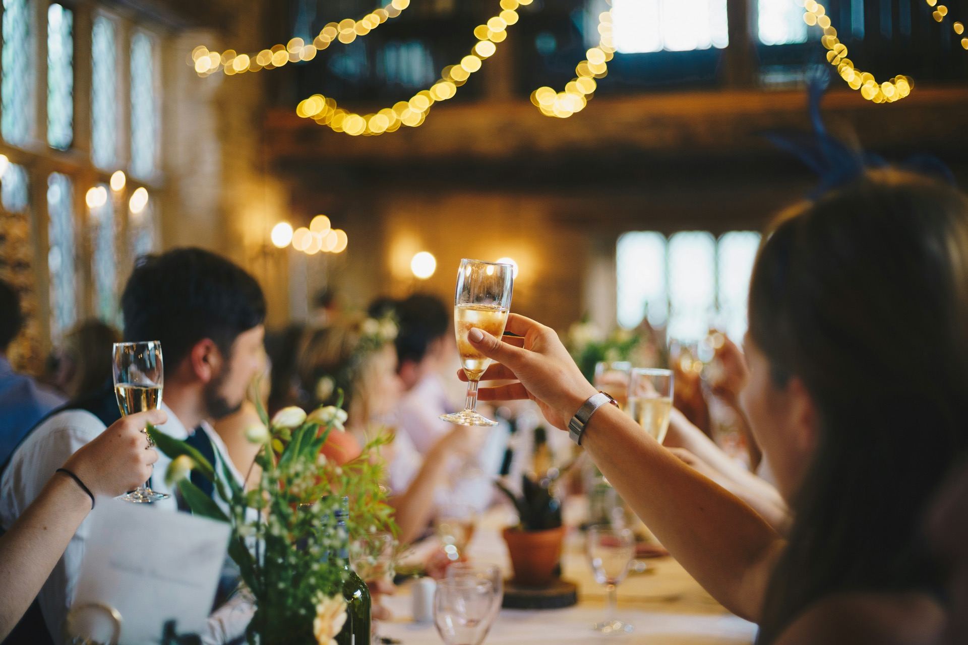Wedding reception with tables and warm lighting